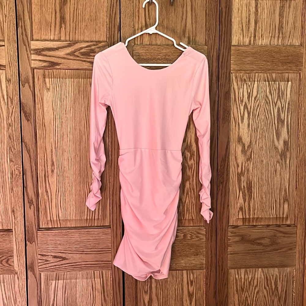 open back long sleeve light pink dress.